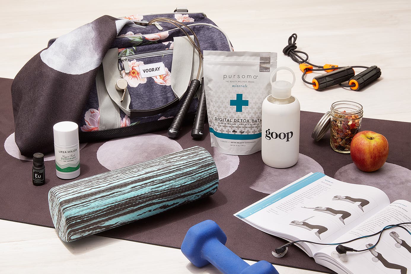 goop fitness products on a yoga mat.