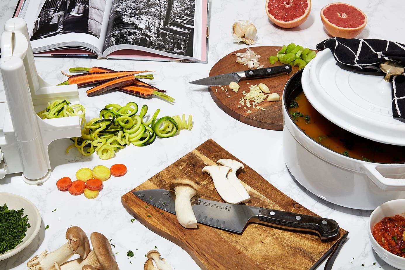 Cut vegetables, fruit and mushrooms on cutting boards.