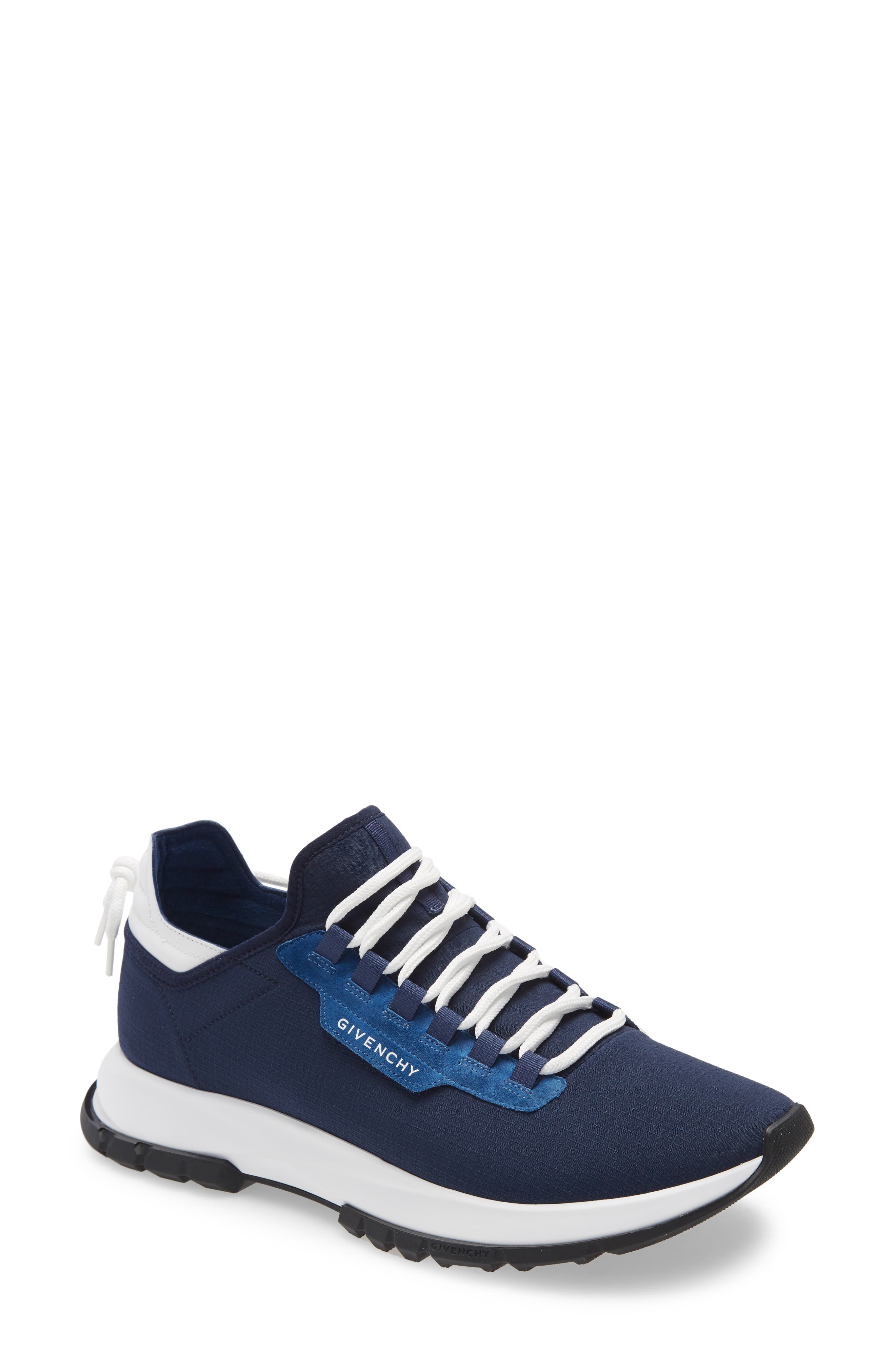 white and blue designer shoes
