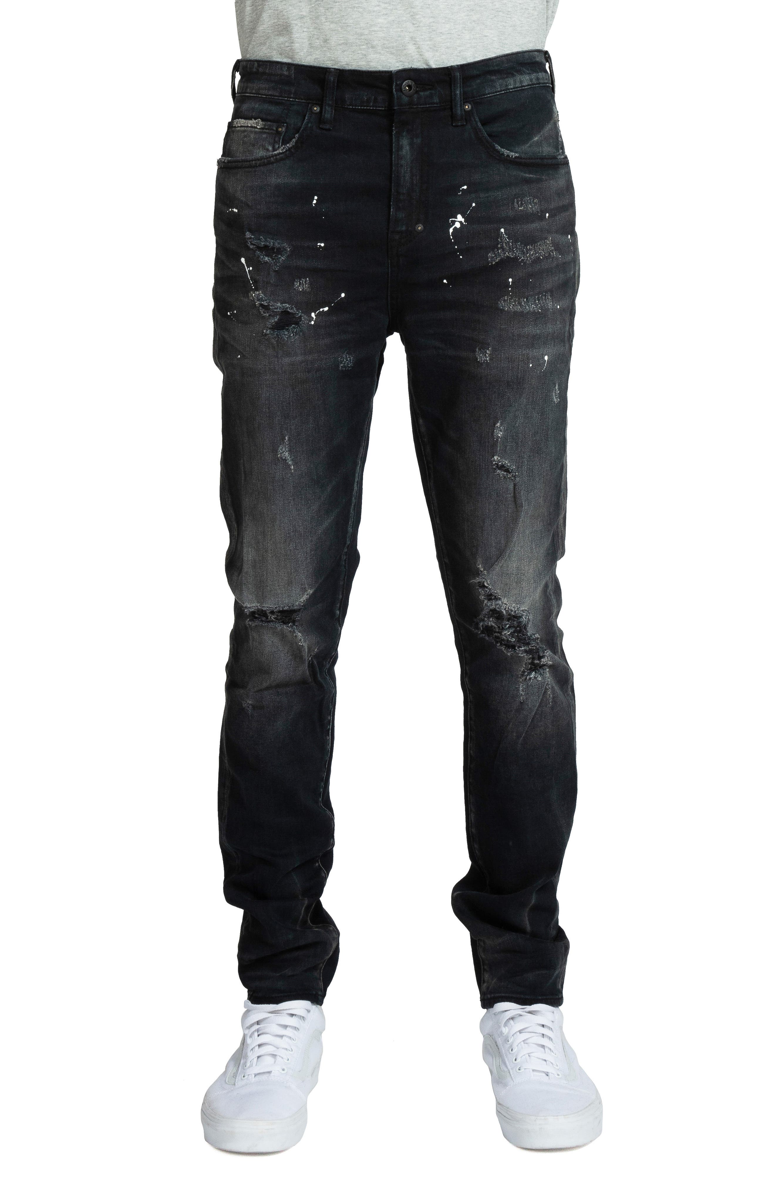 black ripped jeans designer