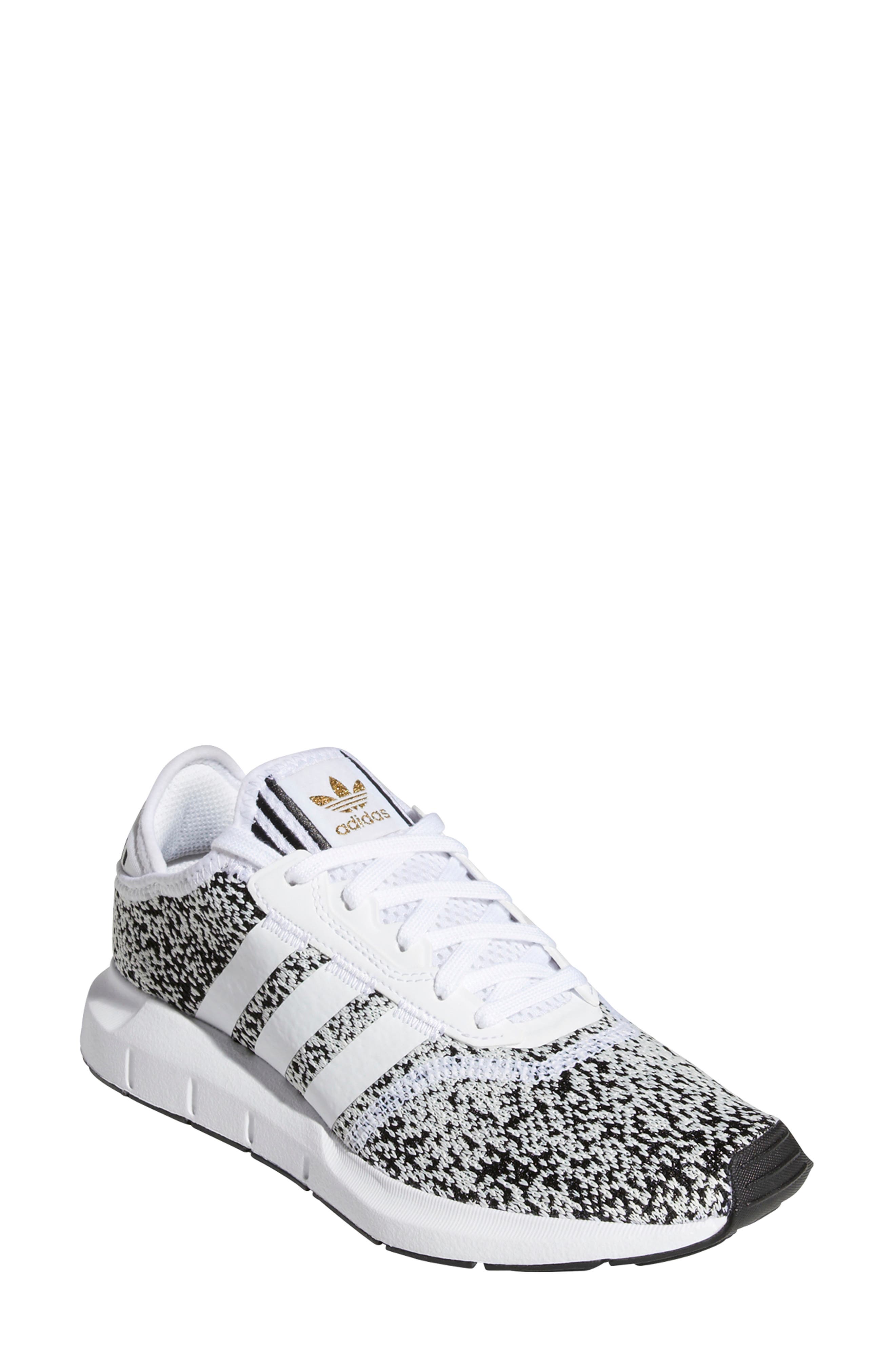 adidas white shoes with grey stripes