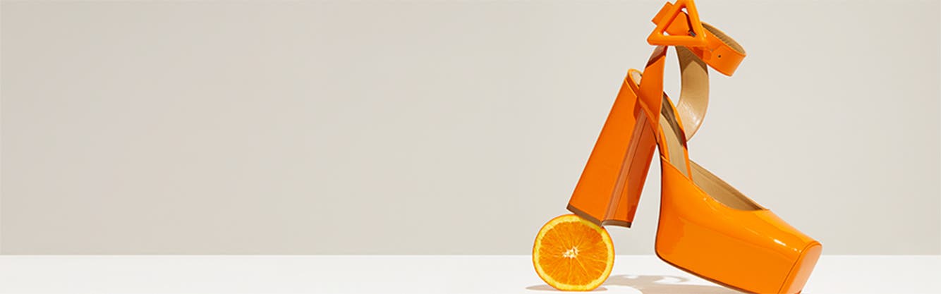 Orange Bottega Veneta platform heels.