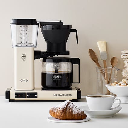 An off-white thermal carafe coffeemaker.