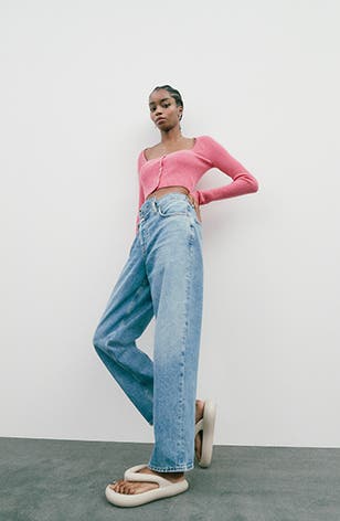 Model wearing straight-leg jeans.