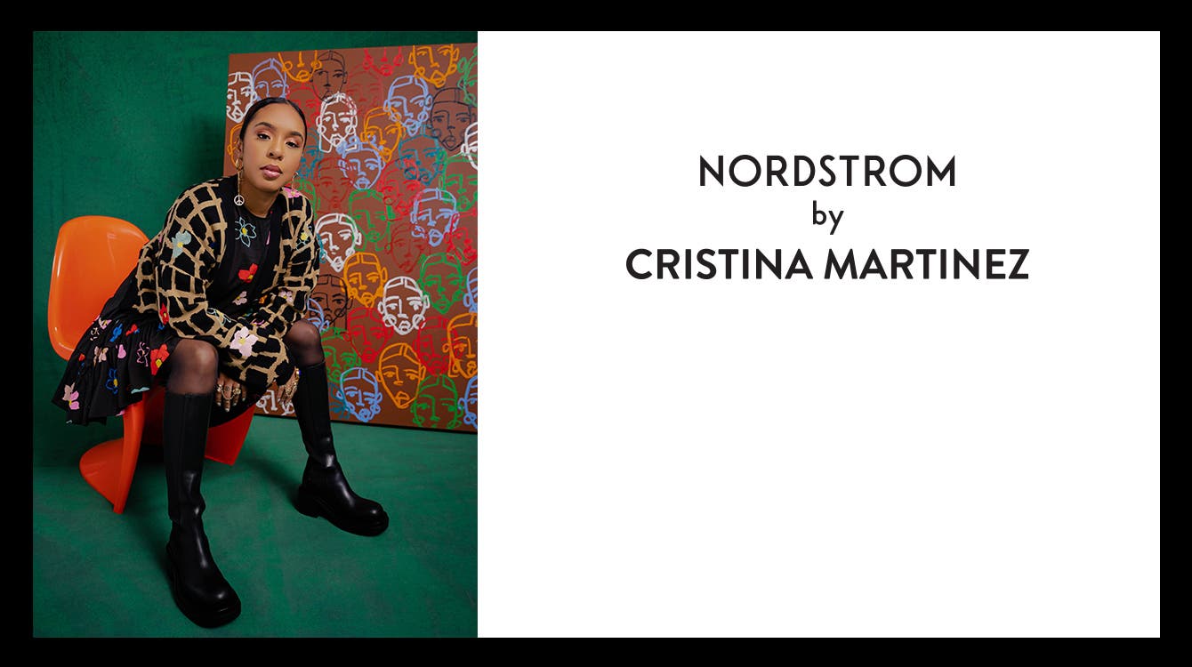 Cristina Martinez wearing Nordstrom by Cristina Martinez clothes in front of her paintings.