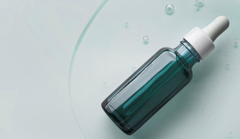 skin care bottle with blue background