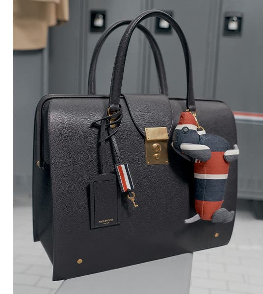 Thom Browne handbag featuring a dog keychain. 