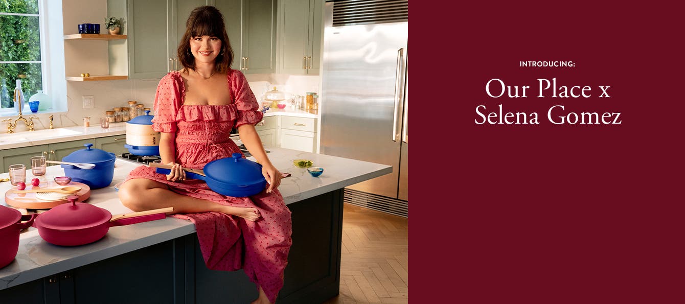 Introducing: Our Place x Selena Gomez: Selena Gomez in a kitchen with the Always Pan and Perfect Pot in blue and rose.