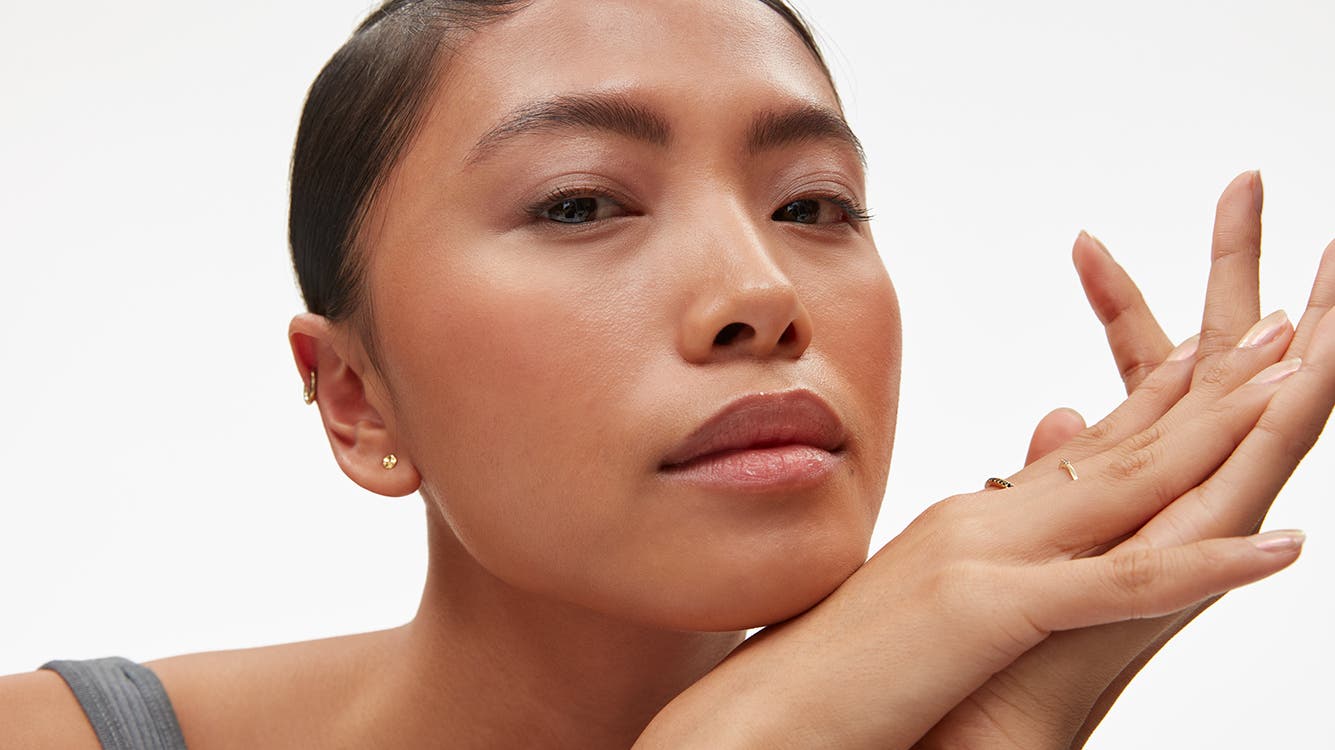 A woman's face and hands.