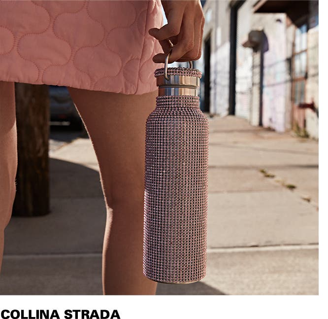 Model holding Collina Strada crystal-embellished water bottle.