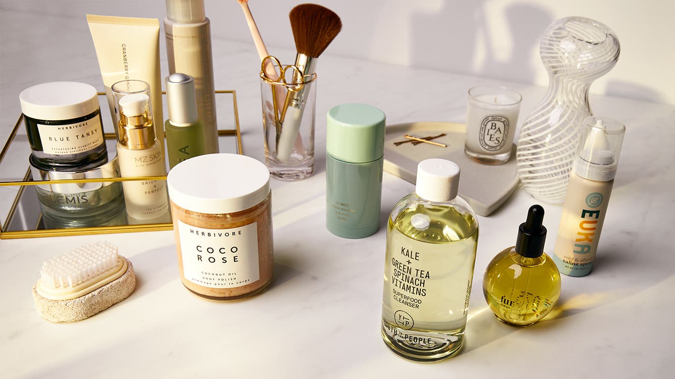 A variety of skin care products and brushes.