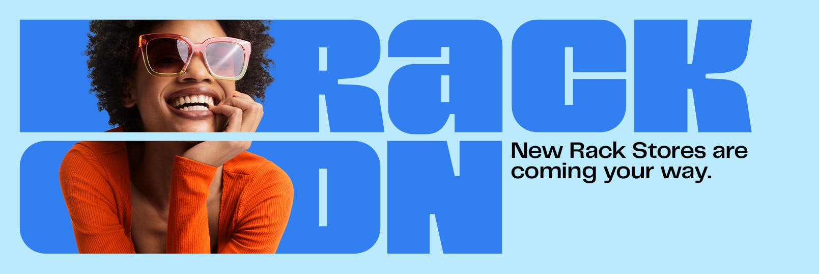 Rack on. New Nordstrom Rack stores are coming your way. Woman in sunglasses and orange sweater.