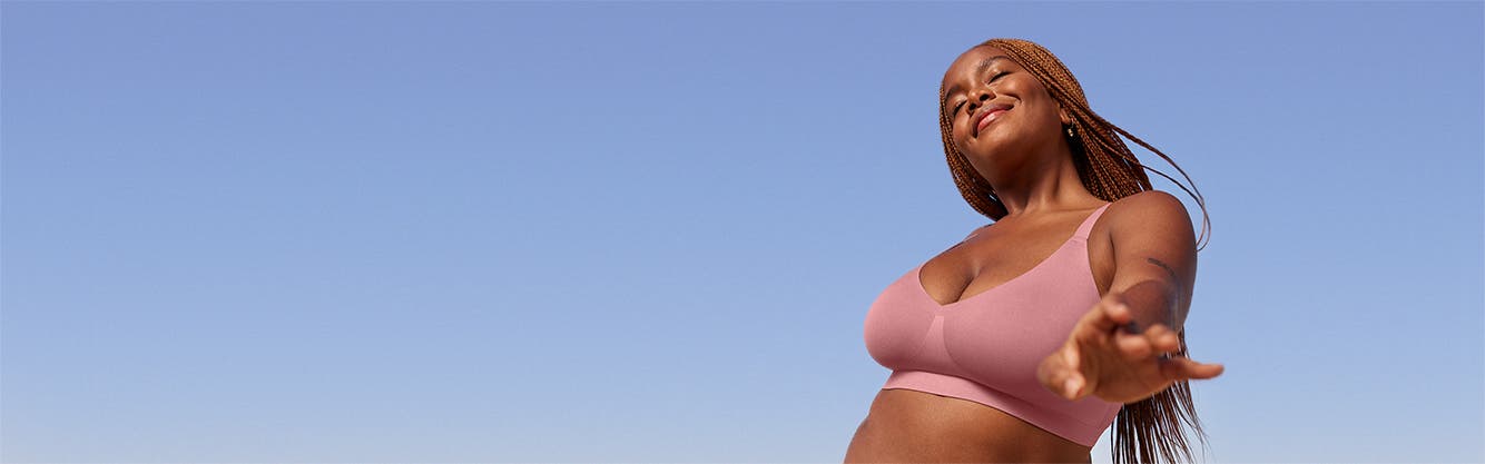 A model wearing a pink bra.