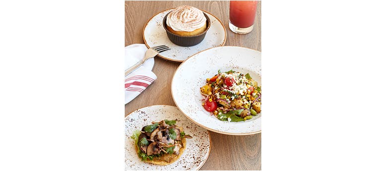 Image of a tres leches cake, a chopped salad and mushroom tostadas.