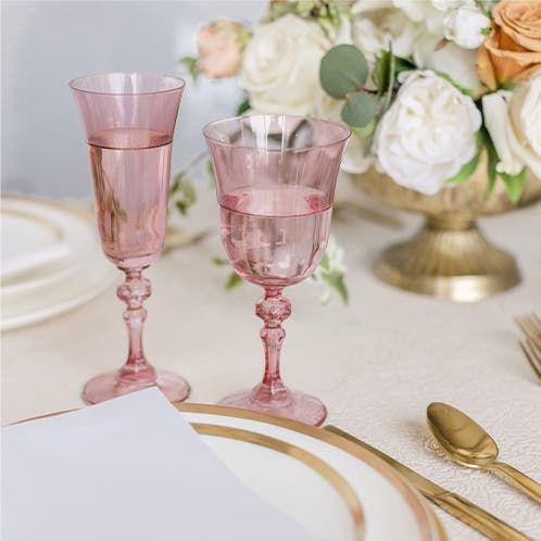 Rose-colored glass goblets and flutes.
