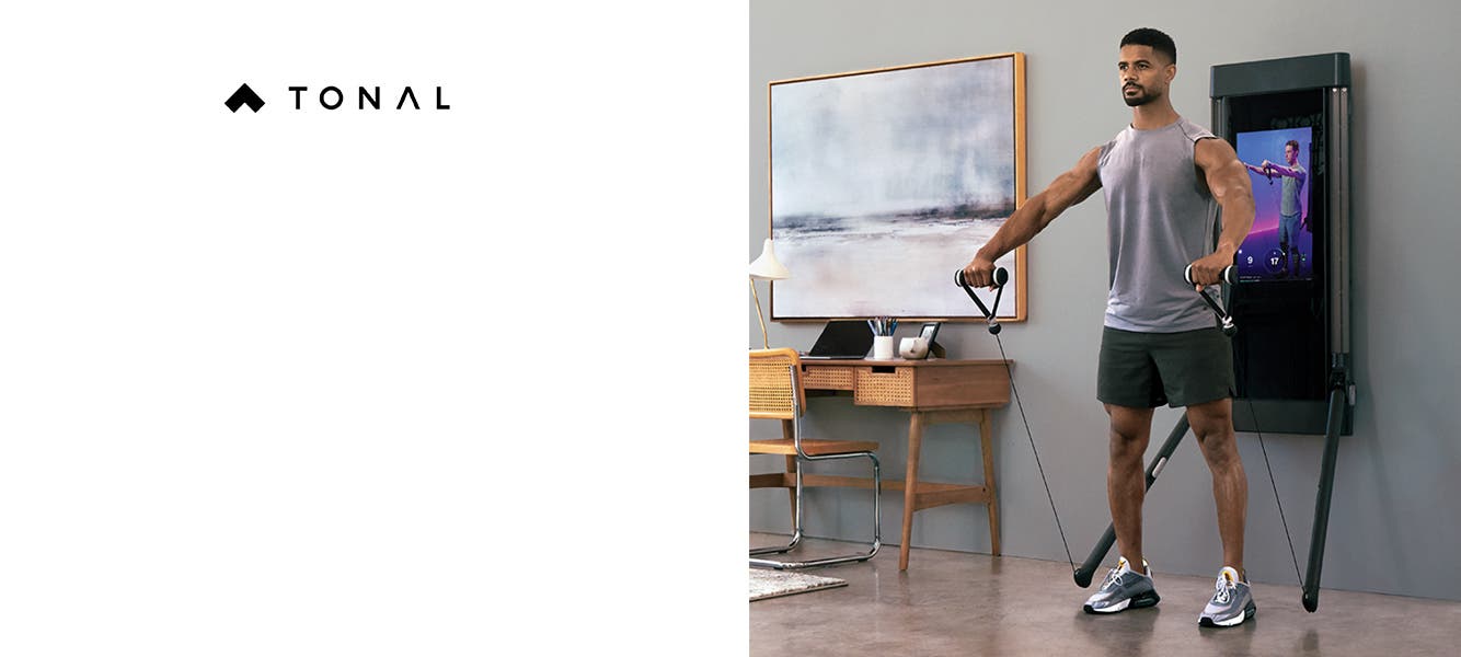 A man exercises at home with Tonal.