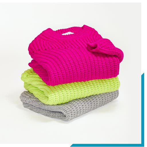 Stack of women's sweaters.