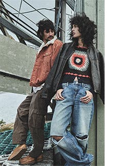 A woman and a young man wearing clothing from BDG Urban Outfitters.