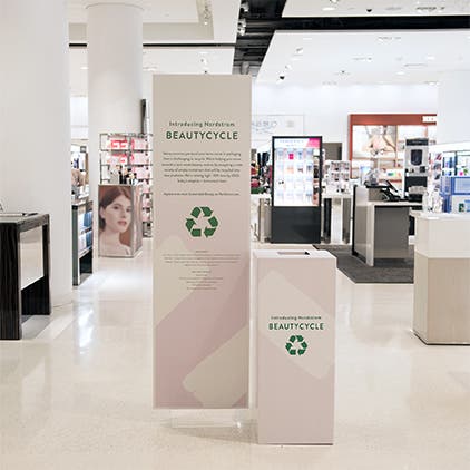 A BEAUTYCYCLE collection bin inside a Nordstrom store.