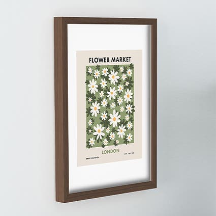 A framed art print of daisies.