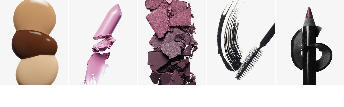 Liquid foundation in three shades. A pale pink lipstick. Eyeshadows in shades of plum. A swipe of mascara. A purple eyeliner pencil.