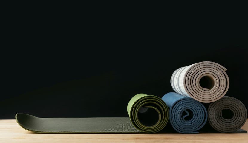 4 different yoga mats stacked