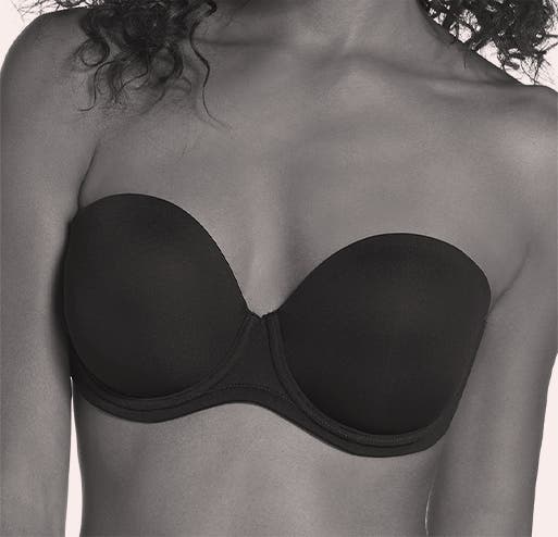 A woman models a strapless bra.