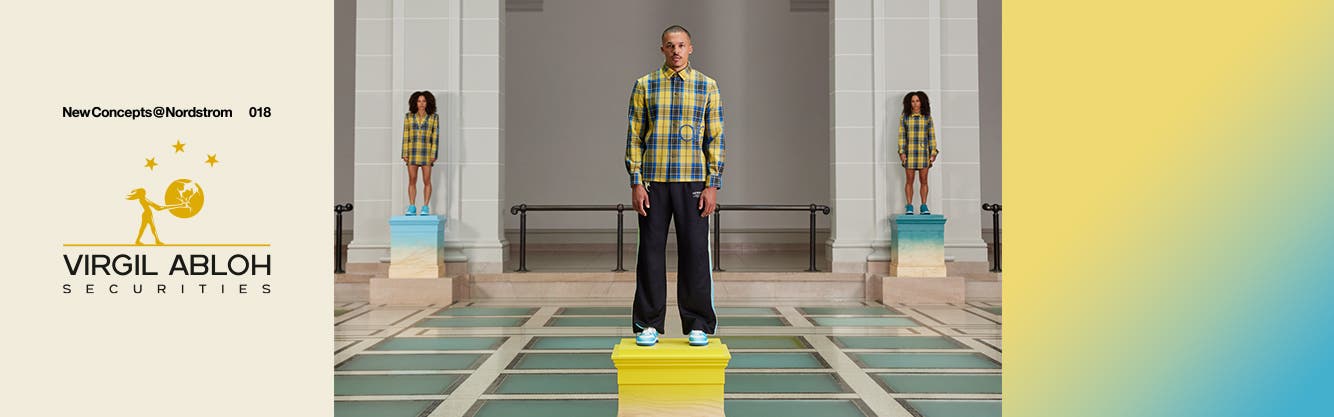 New Concepts 018: Virgil Abloh Securities. Three models wearing yellow and blue plaid stand on museum pedestals.