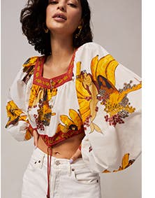 A woman wearing a printed top.