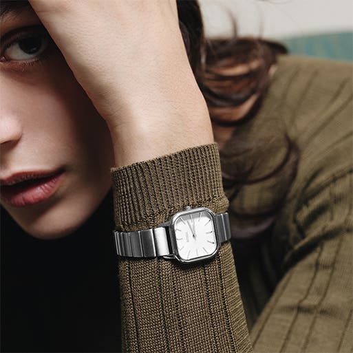 A model wearing a watch.