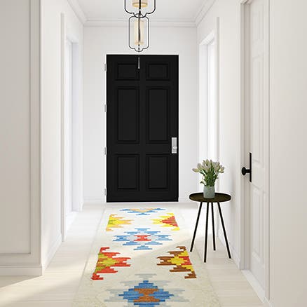 A bold geometric patterned area rug.