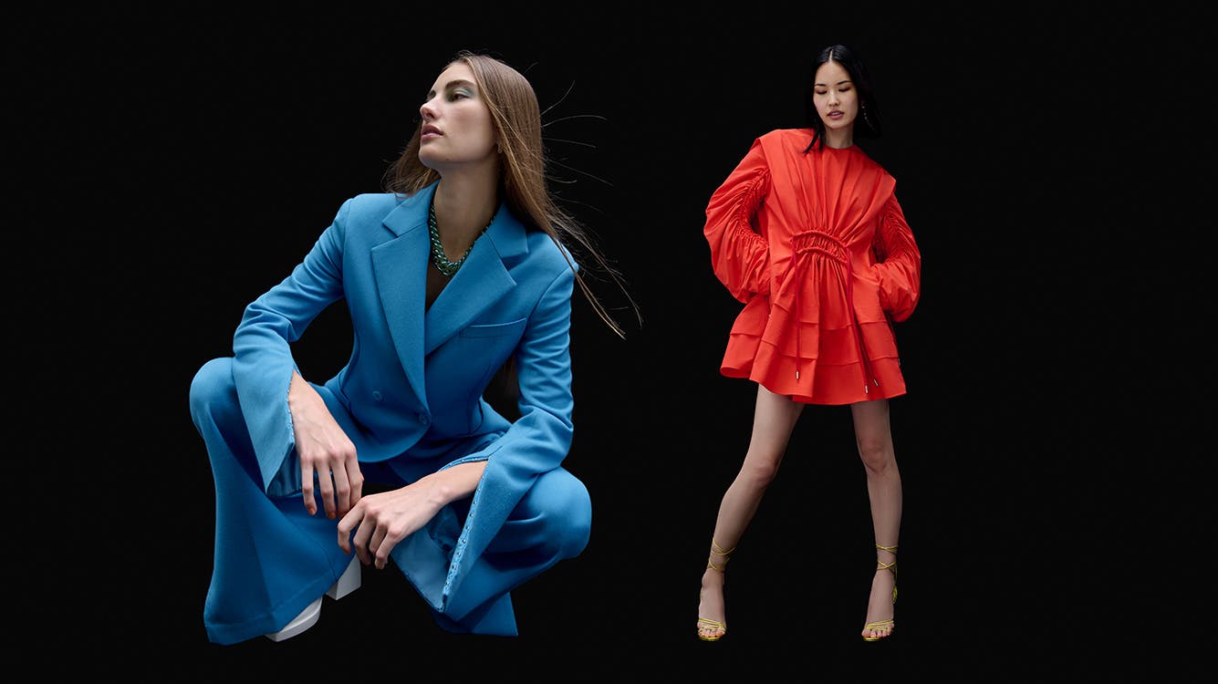 Model in blue blazer and pants; model in short orange dress.