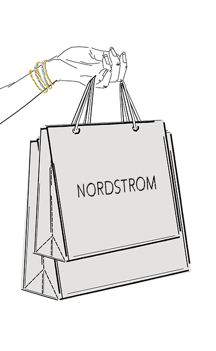 Hand holding Nordstrom bags.