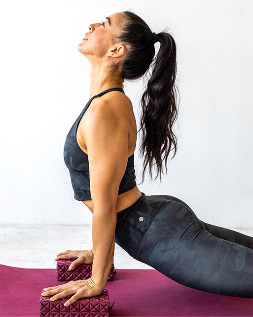 Woman practicing yoga in Zella leggings and tops.