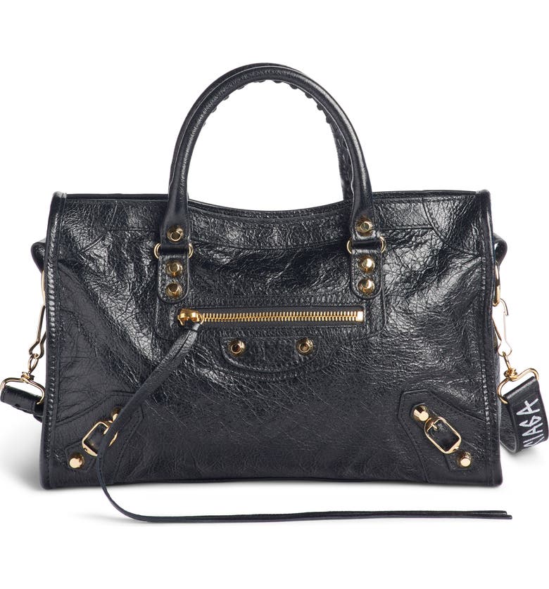 Click to view more detailed imagery on our partner's website Balenciaga Arena Classic City Leather Tote With Graffiti Strap - Black In Noir