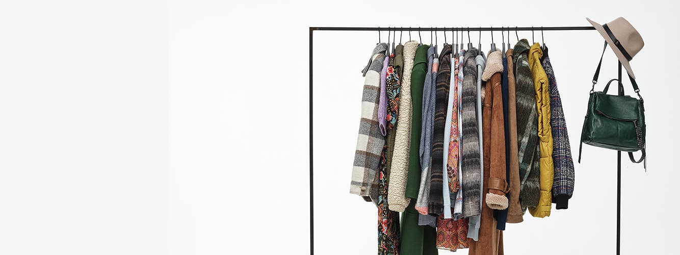 Personal styling your way. A rack of clothing and accessory options.