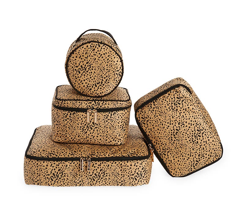 Set of four leopard-print packing cubes.