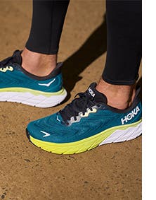Woman wearing HOKA ONE ONE active shoes.