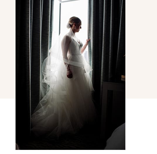 Real Weddings: bride Katie Devlaminck looks out the window.