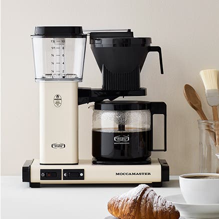 An off-white thermal carafe coffeemaker.