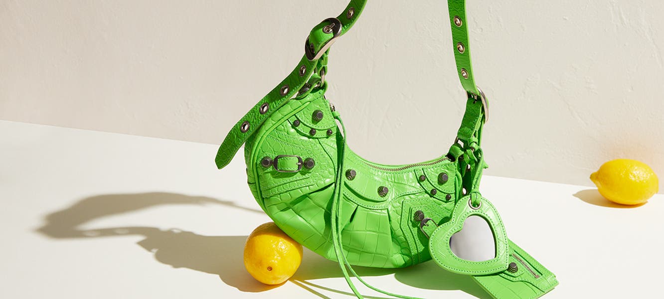 Green Balenciaga handbag, orange Bottega Veneta shoe, green Miu Miu loafers, yellow Bottega Veneta heels, Loewe handbag.