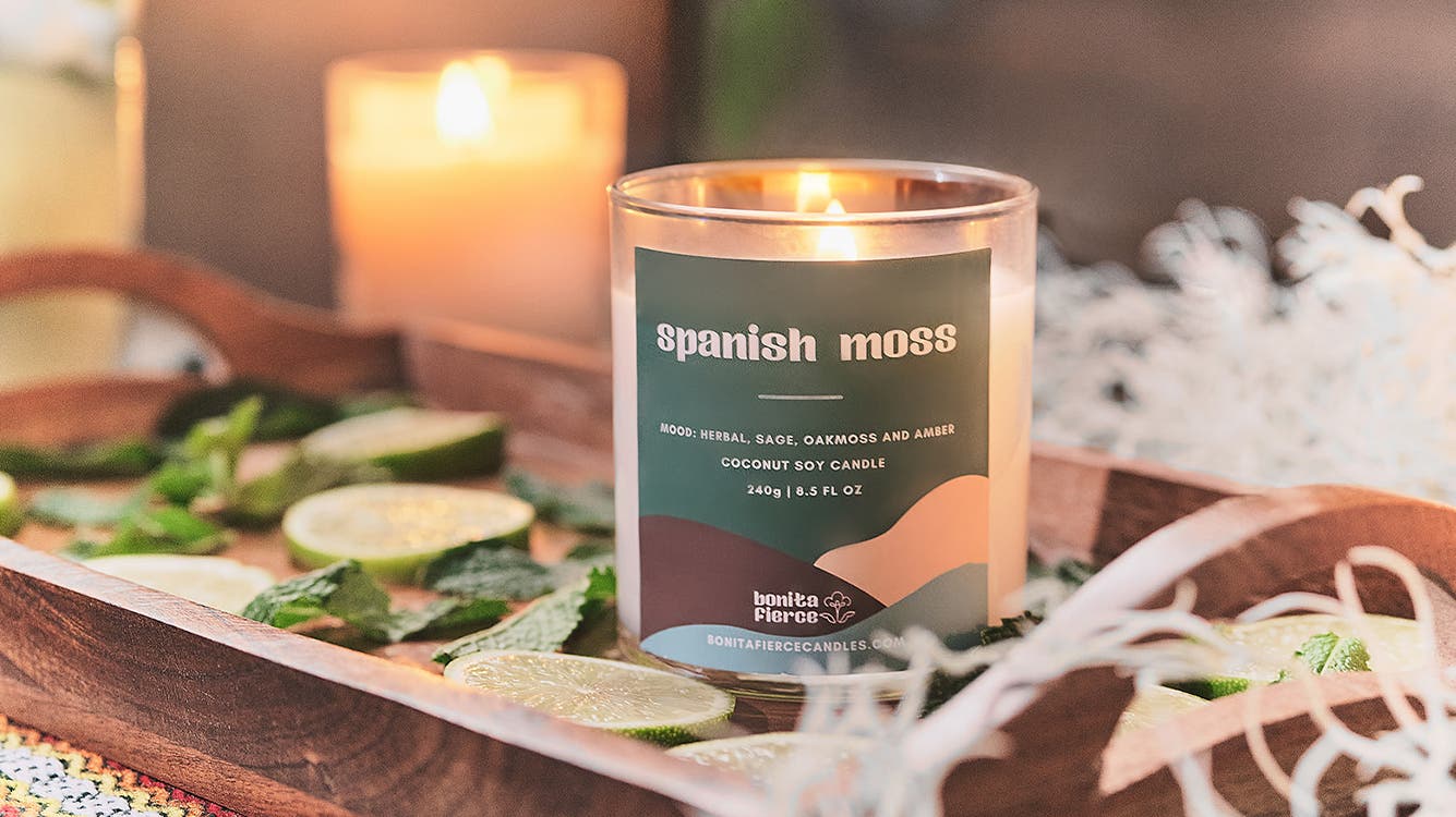 A Bonita Fierce candle in a tray.