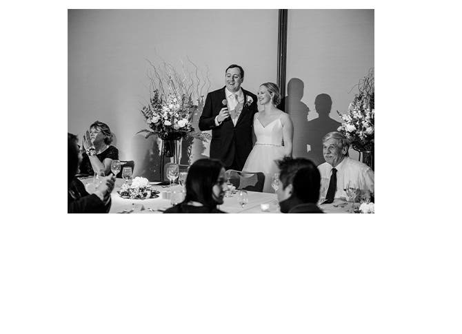 Real Weddings: bride Katie Devlaminck and groom Dan Krisch give a toast.