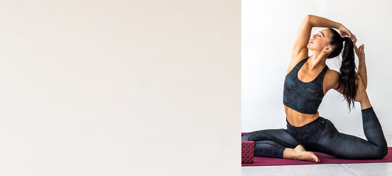 Influencer Meagan Kong practicing yoga in Zella leggings and sports bra.