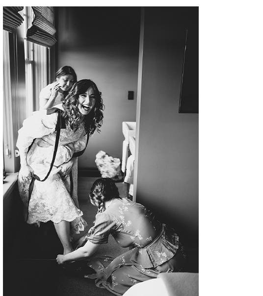The bride has some help getting ready before making her debut.