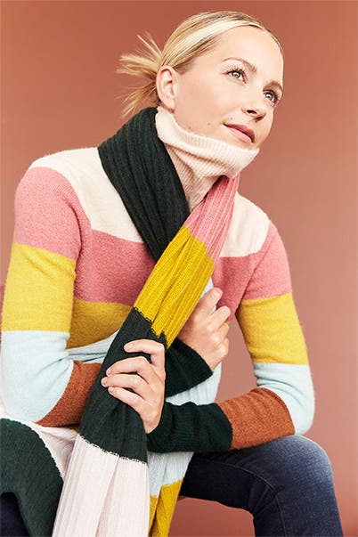 Blair Eadie in a colorful sweater and scarf. 