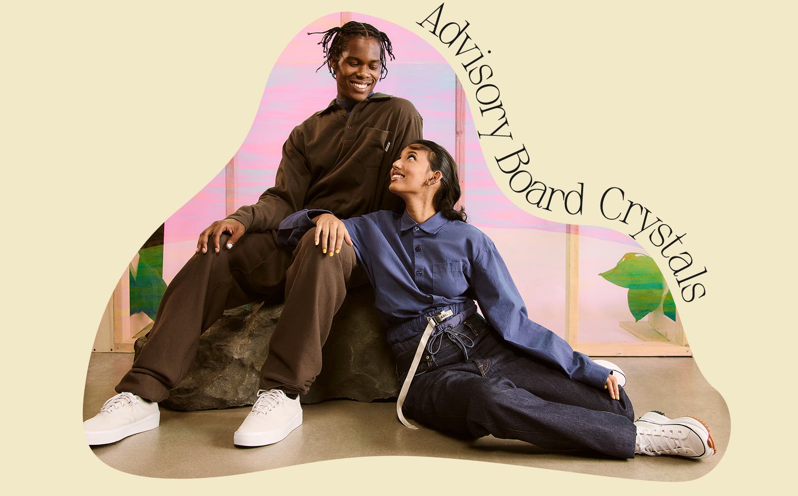 A man and a woman wearing clothing from Advisory Board Crystals.
