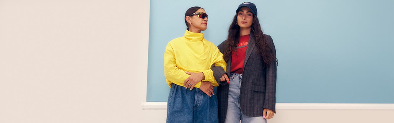 A mother and daughter posing in styles from the fall '22 Nordstrom x Nike collection.