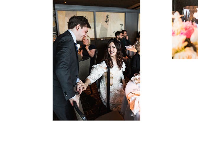 The bride and groom share a special moment at their table during the reception.