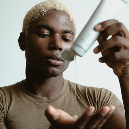 A man applying a skin care product.